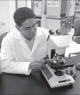 When adjusting the microscope, the technologist observes the objective carefully to prevent breaking the slideand damaging the objective lens of the microscope.